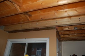 Sister joists attached to the split joist with carriage bolts.