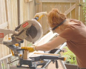 Cutting dado notches in 2 x 4s with a sliding compound mitre saw.